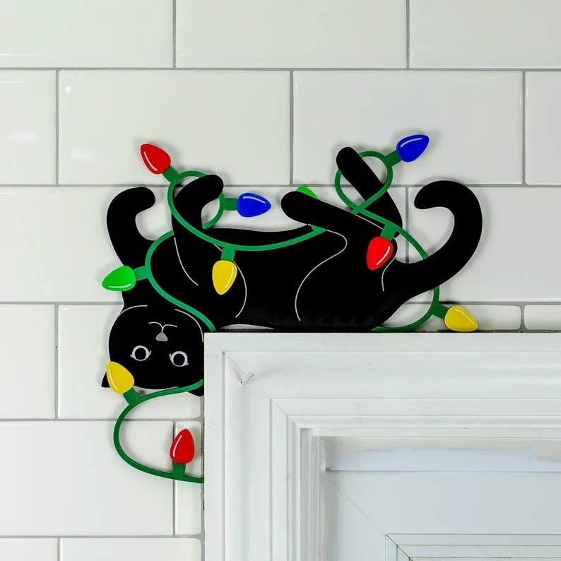 Funny Cat Playing with Christmas Lights Door Corner Sign
